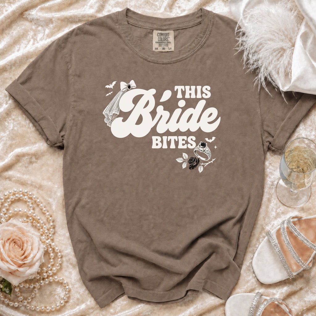 Brown t-shirt with "This Bride Bites" graphic, veil, bats, and skull ring.