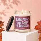 Candle with "One more and I get a toaster" text on label, lid off.
