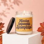 Candle with "Mission Impossible Accomplished" text on a yellow label.