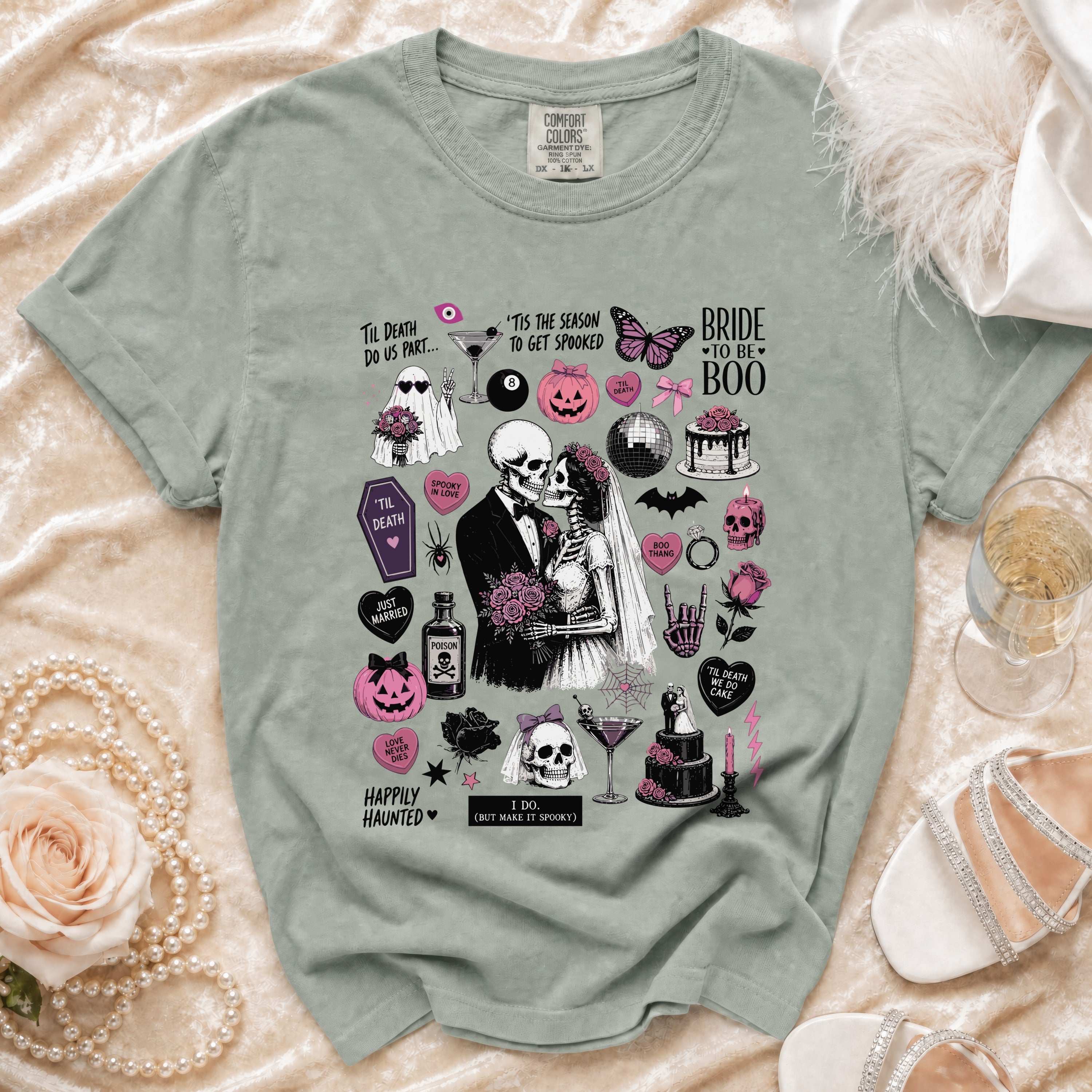 Skeleton bride and groom on a t-shirt with Halloween-themed graphics and text.
