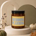 Candle jar with "Wedding Planning" text on yellow label.