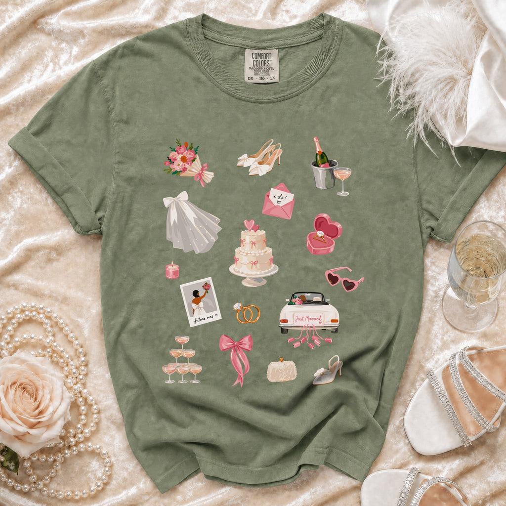 Green t-shirt with watercolor wedding graphics: bouquet, cake, rings, car, shoes, and champagne.