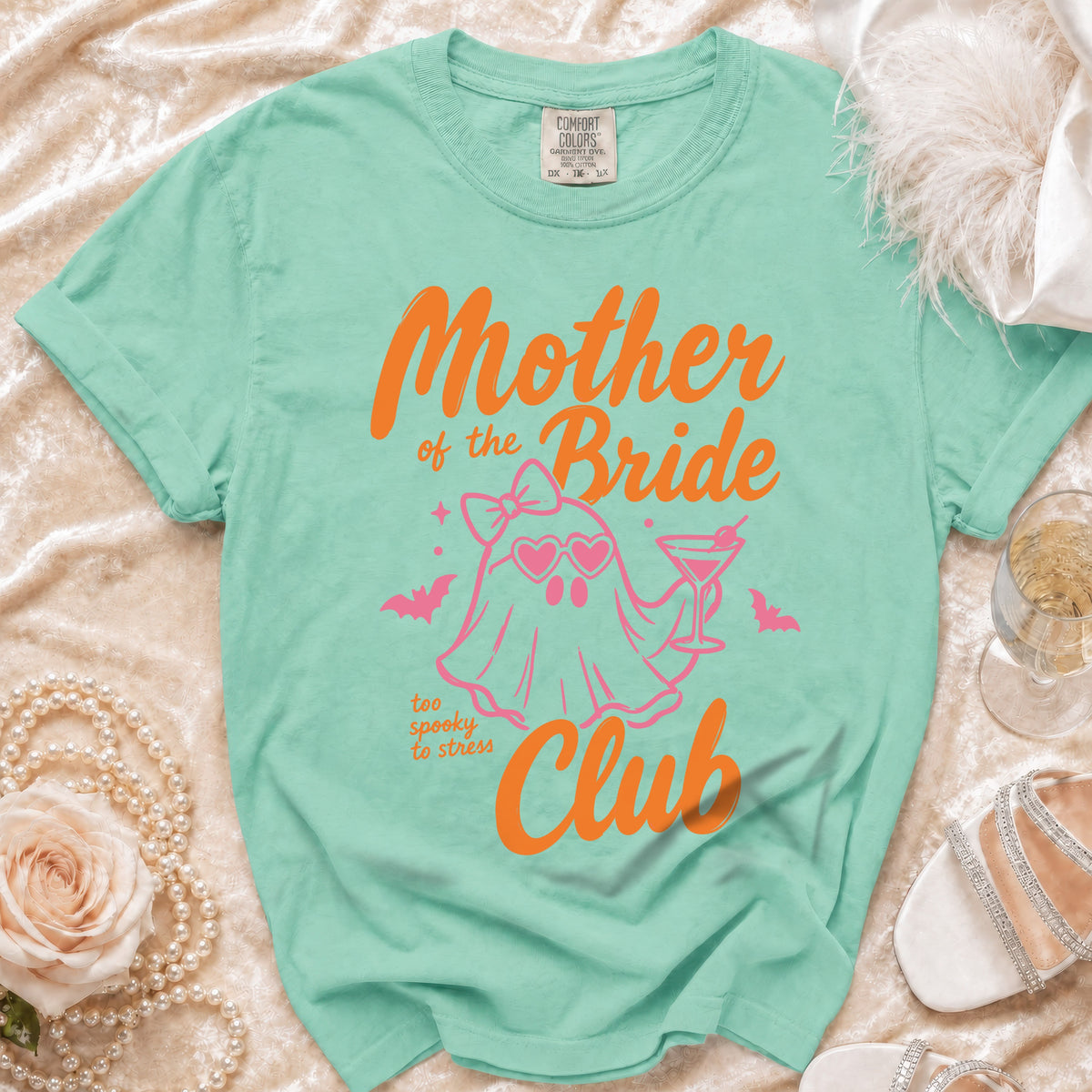 Mint green Comfort Colors shirt with "Mother of the Bride Too Spooky to Stress Club" graphic.
