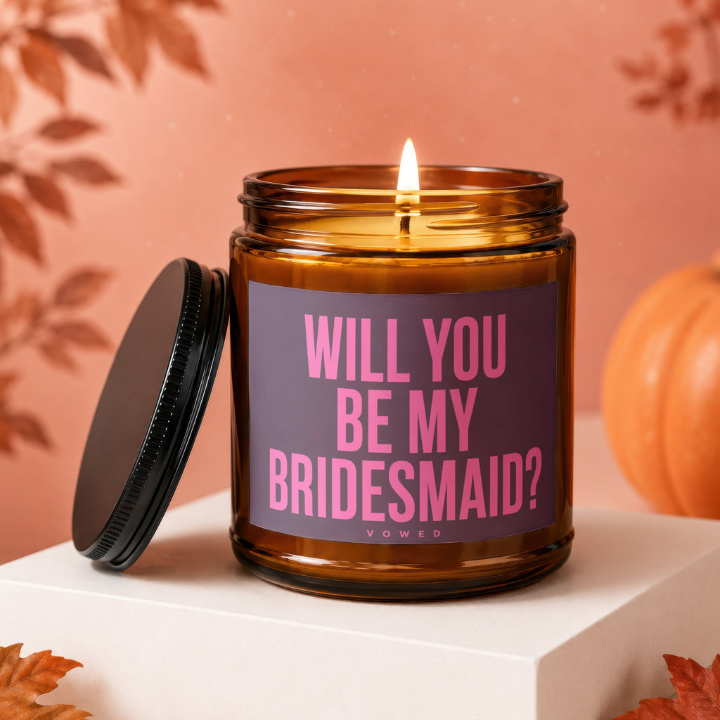 Amber candle with lit wick, asking "Will You Be My Bridesmaid?".