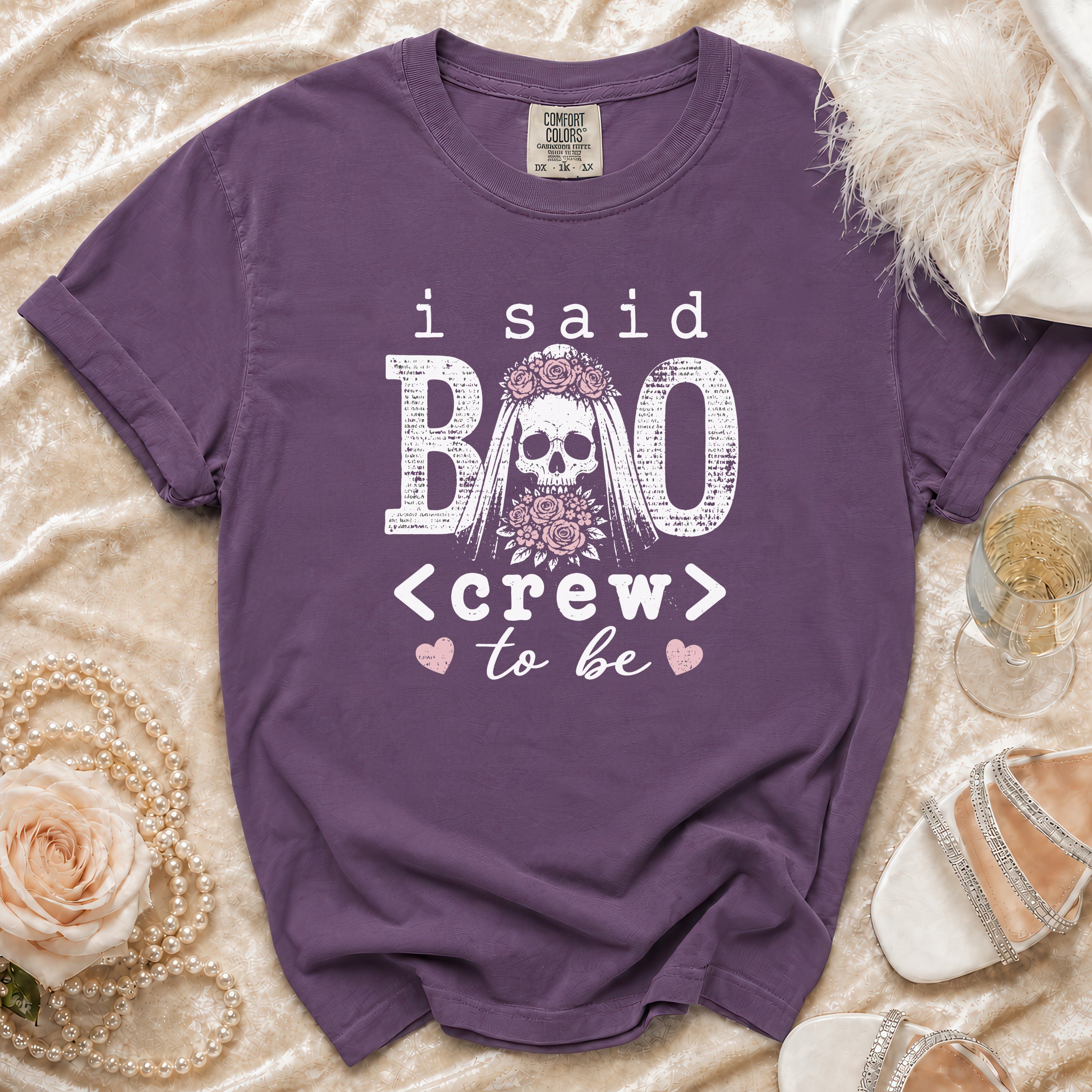 Purple t-shirt with "I Said Boo Crew to Be" text and skull graphic.