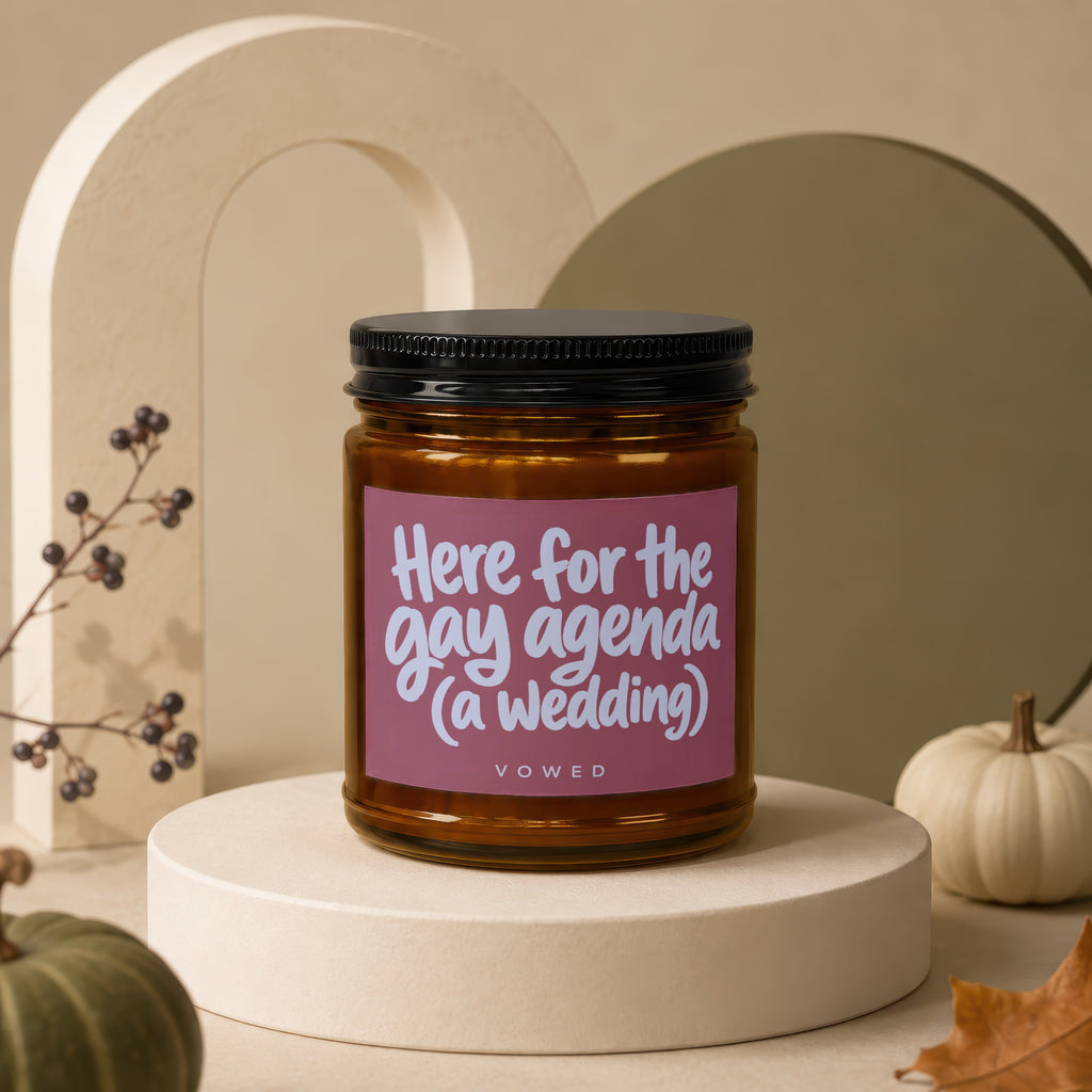 Candle with text "Here for the gay agenda (a wedding)" and "VOWED".