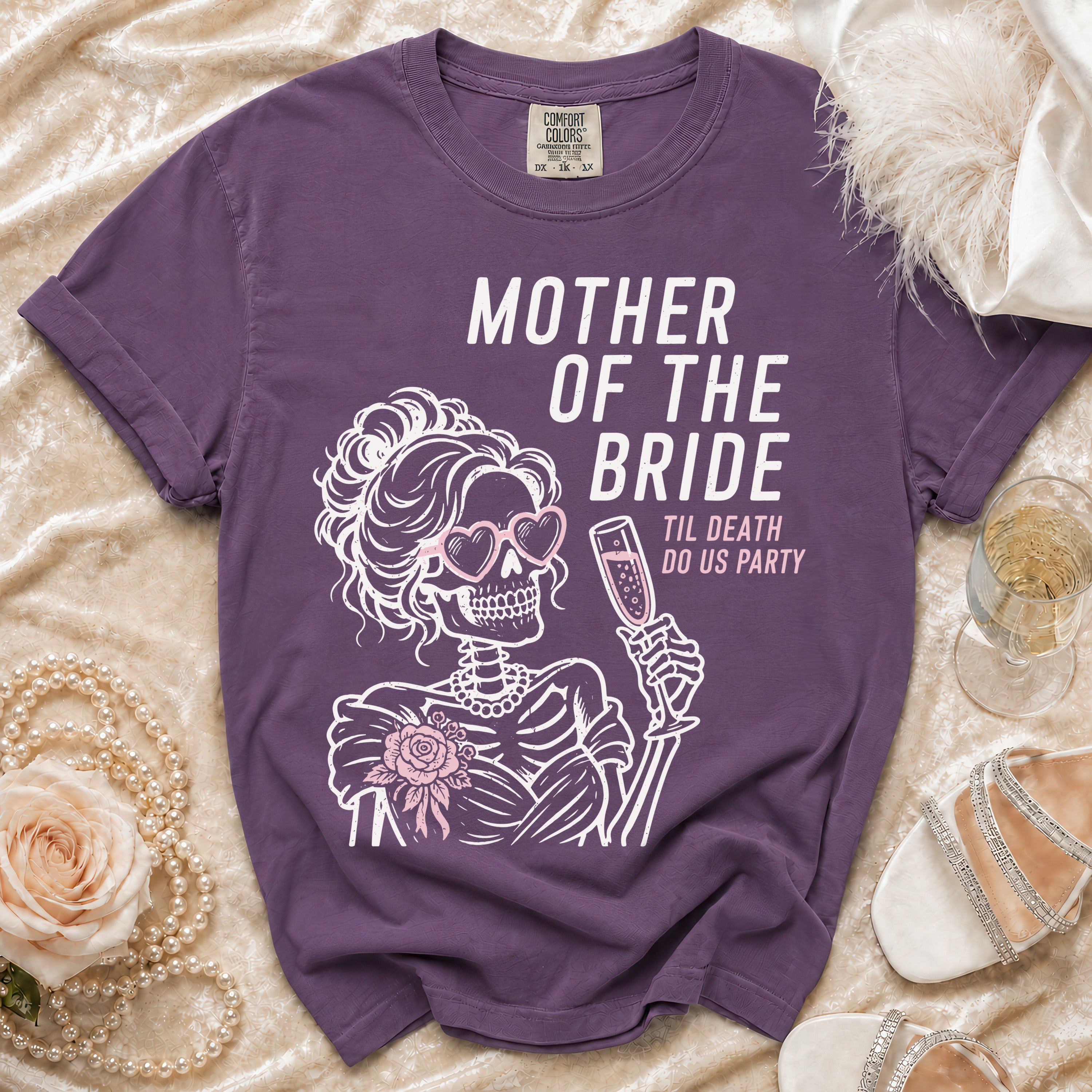Purple t-shirt with skeleton bride graphic reading "Mother of the Bride Til Death Do Us Party."