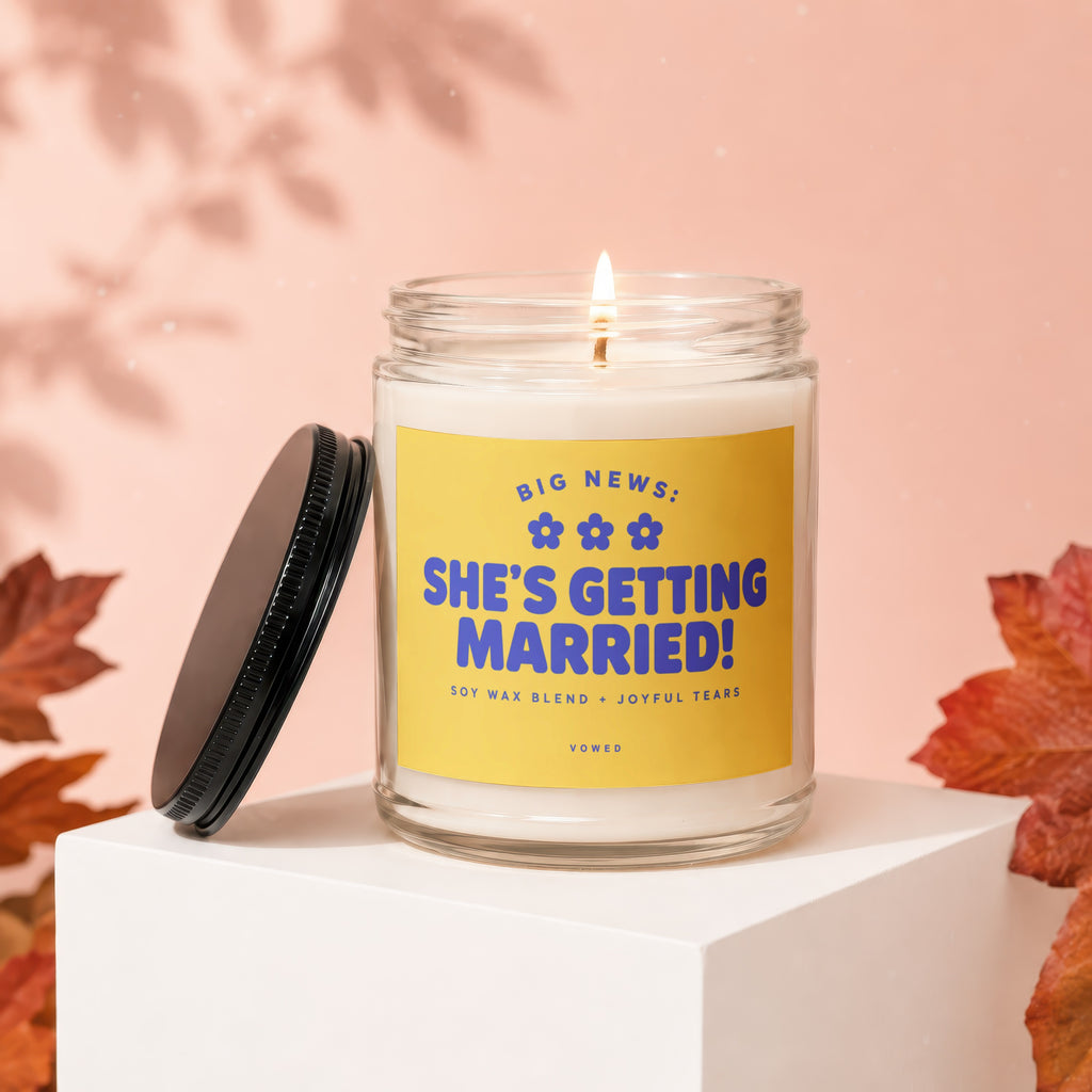Glass candle with "She's Getting Married!" text, soy wax blend, and joyful tears.