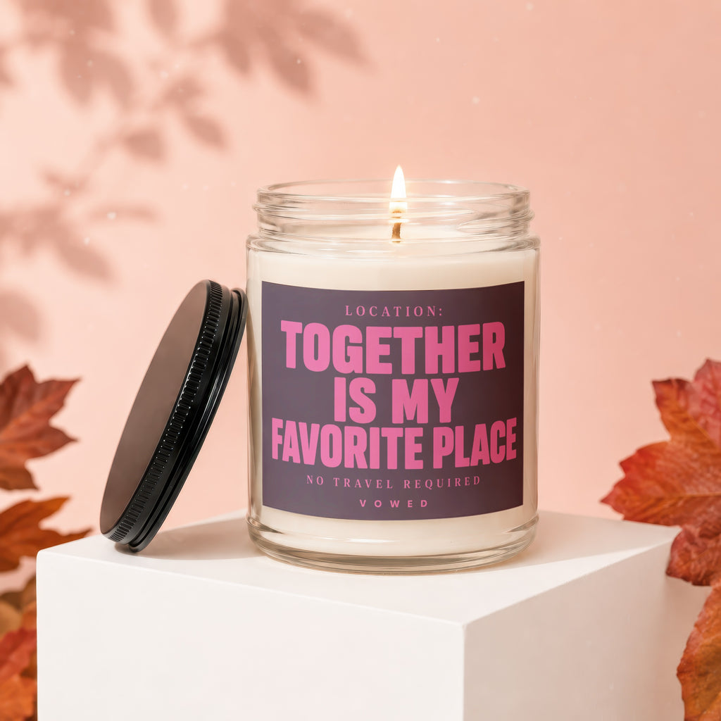 Glass candle with lit wick and black lid, featuring "Together Is My Favorite Place" text.