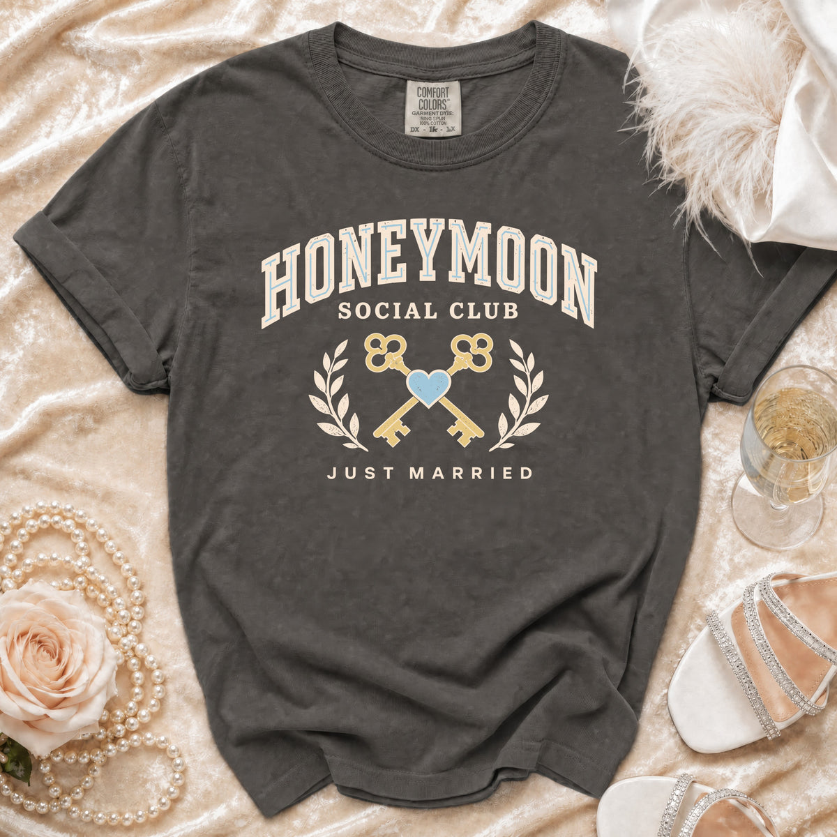 Dark grey t-shirt with "Honeymoon Social Club" and "Just Married" graphic.