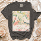 Gray t-shirt with "This girl needs a margarita" text and margarita graphic.