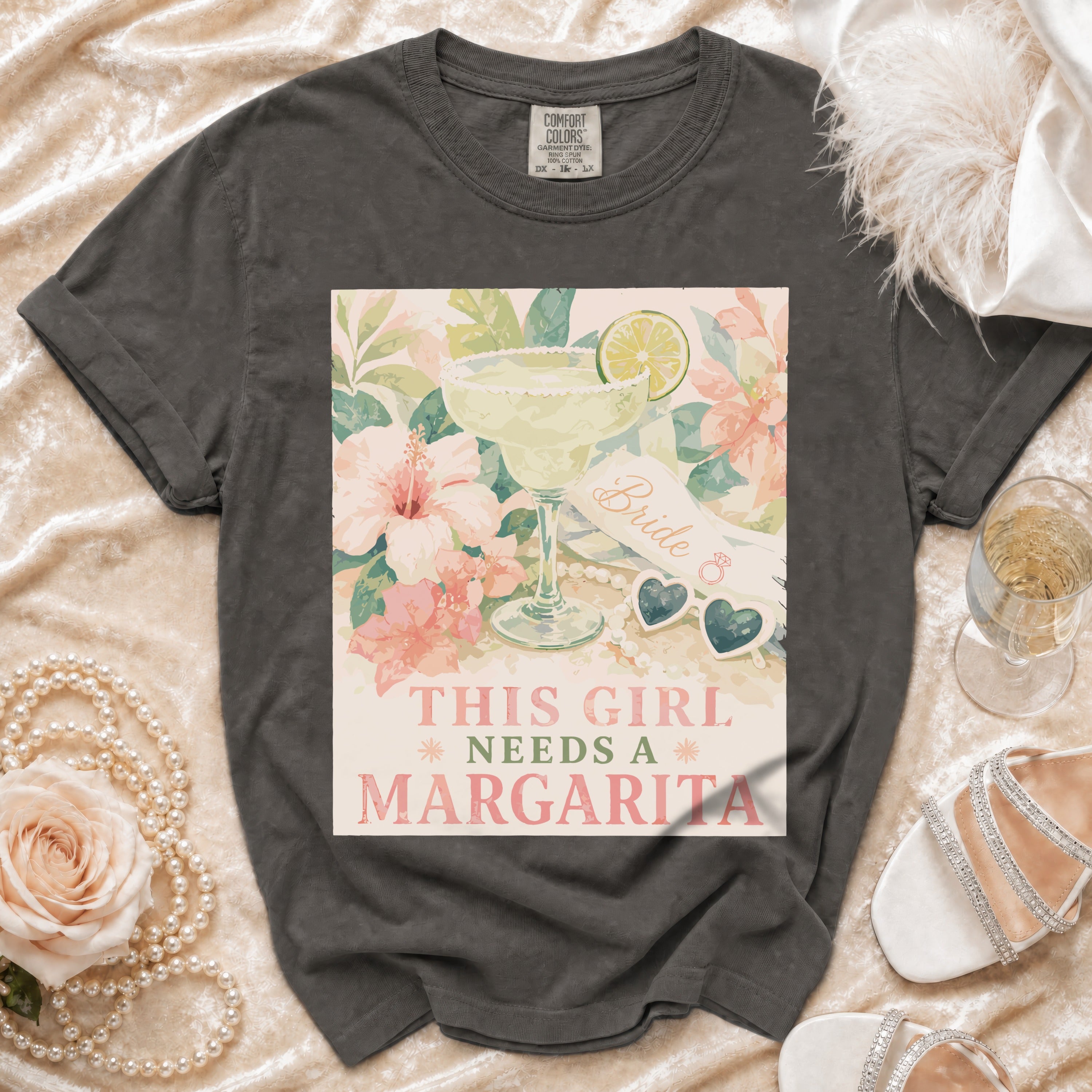Gray t-shirt with "This girl needs a margarita" text and margarita graphic.