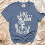 T-shirt with "Tired Mother of the Bride" graphic and coffee cup.