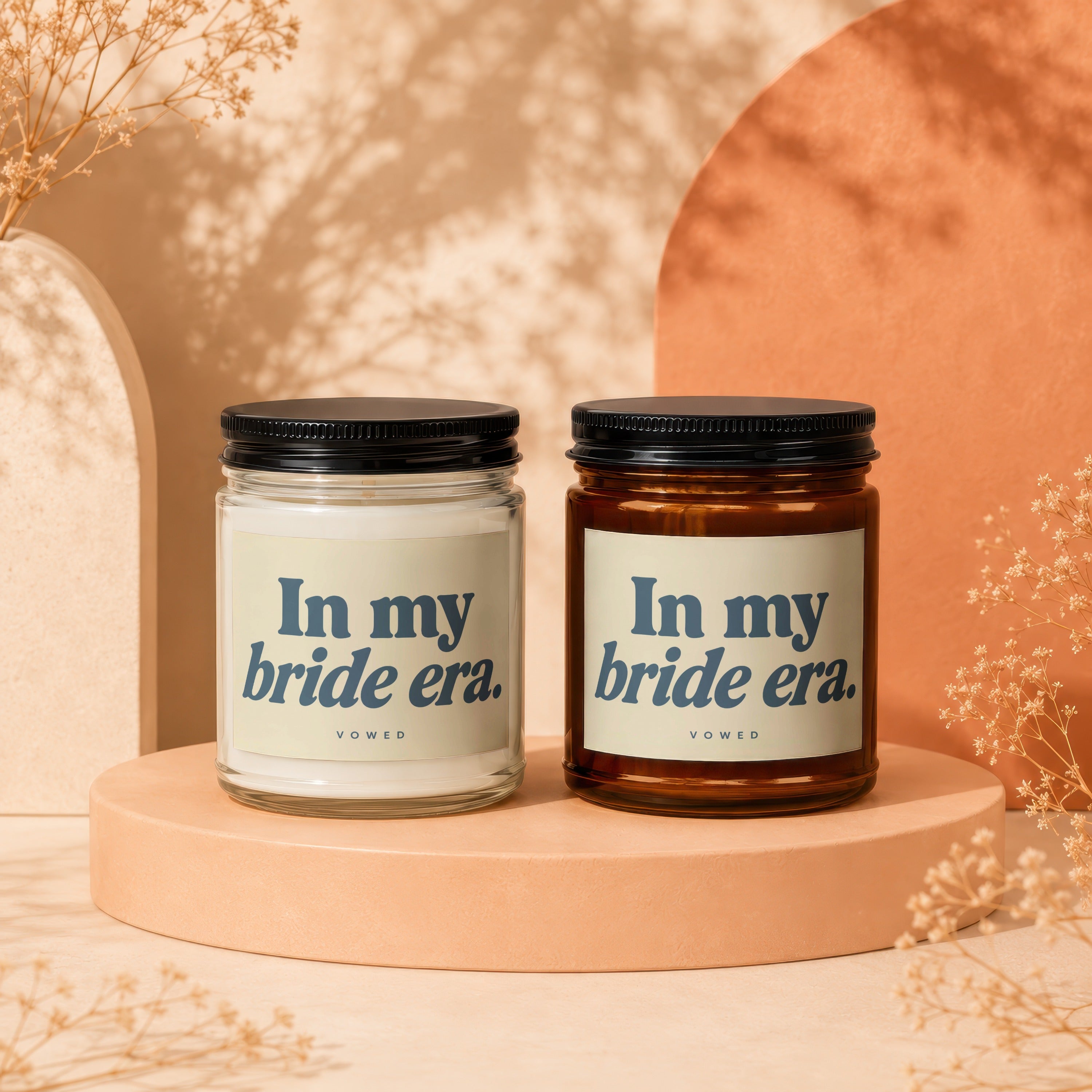 Two candles, one white and one amber, labeled "In my bride era."