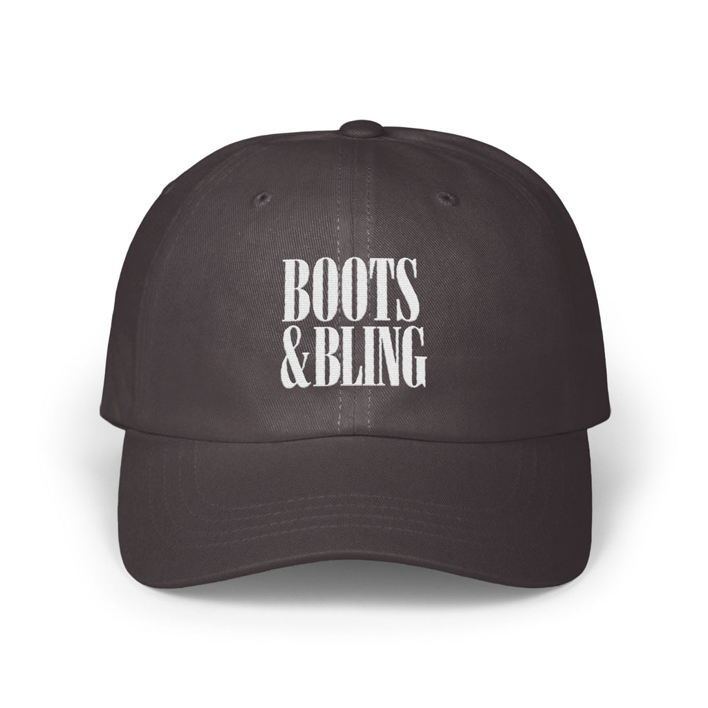 Dark grey dad hat with white embroidered text reading BOOTS & BLING on the front crown.