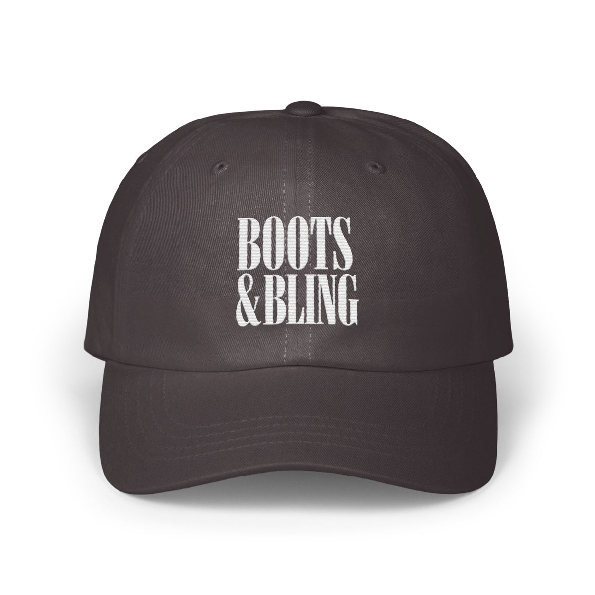 Dark grey dad hat with white embroidered text reading BOOTS & BLING on the front crown.