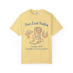 Yellow t-shirt with "Her Last Rodeo" text, cowboy boot, hat, and horseshoe.