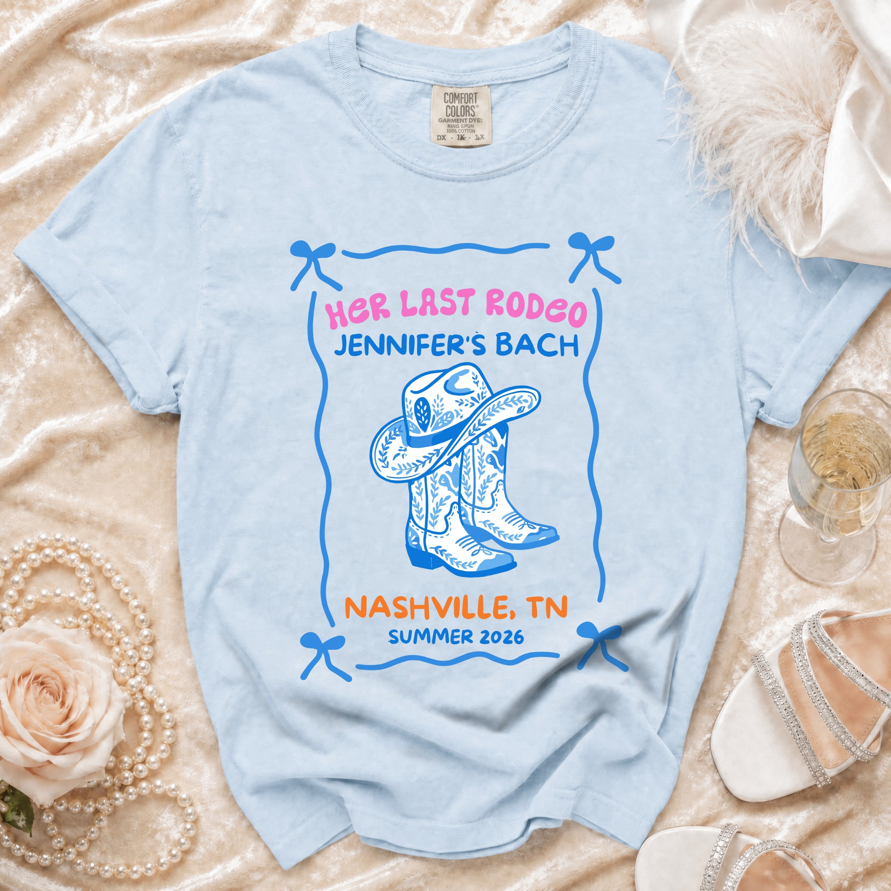 Blue t-shirt with "Her Last Rodeo Jennifer's Bach" and cowboy boots graphic.