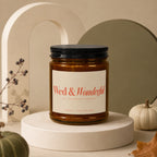 Amber jar candle with black lid, label reads "Wed & Wonderful TO THE HAPPY COUPLE".