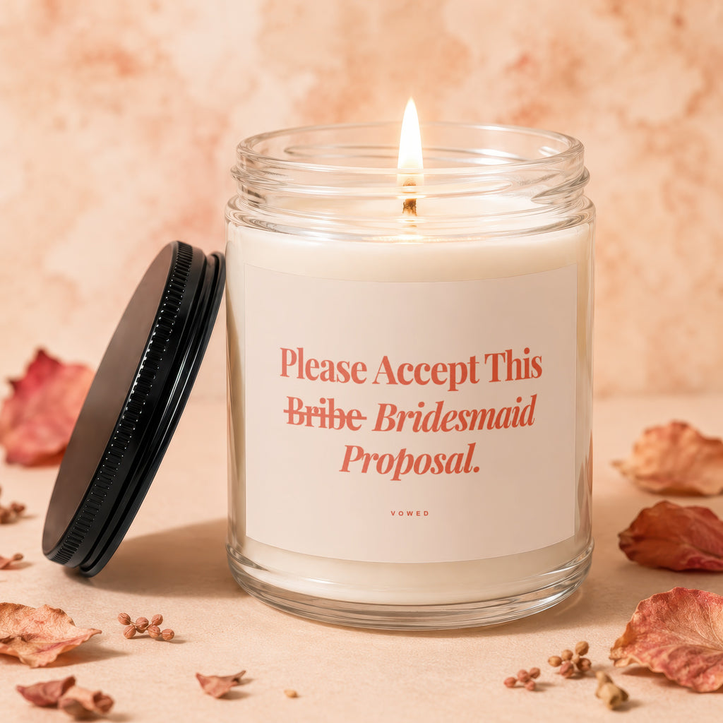 Candle with text "Please Accept This Bribe Bridesmaid Proposal."