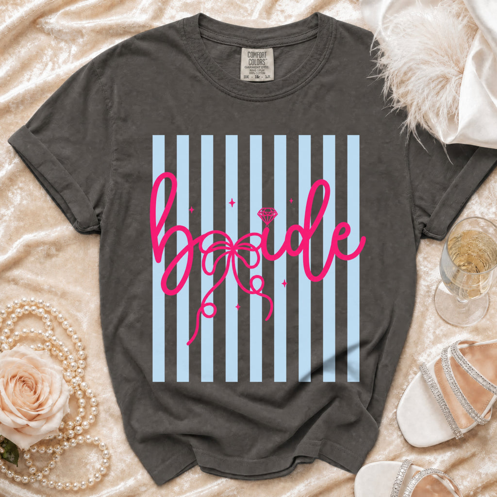 Dark gray t-shirt with "Bride" in pink cursive on blue and gray stripes.