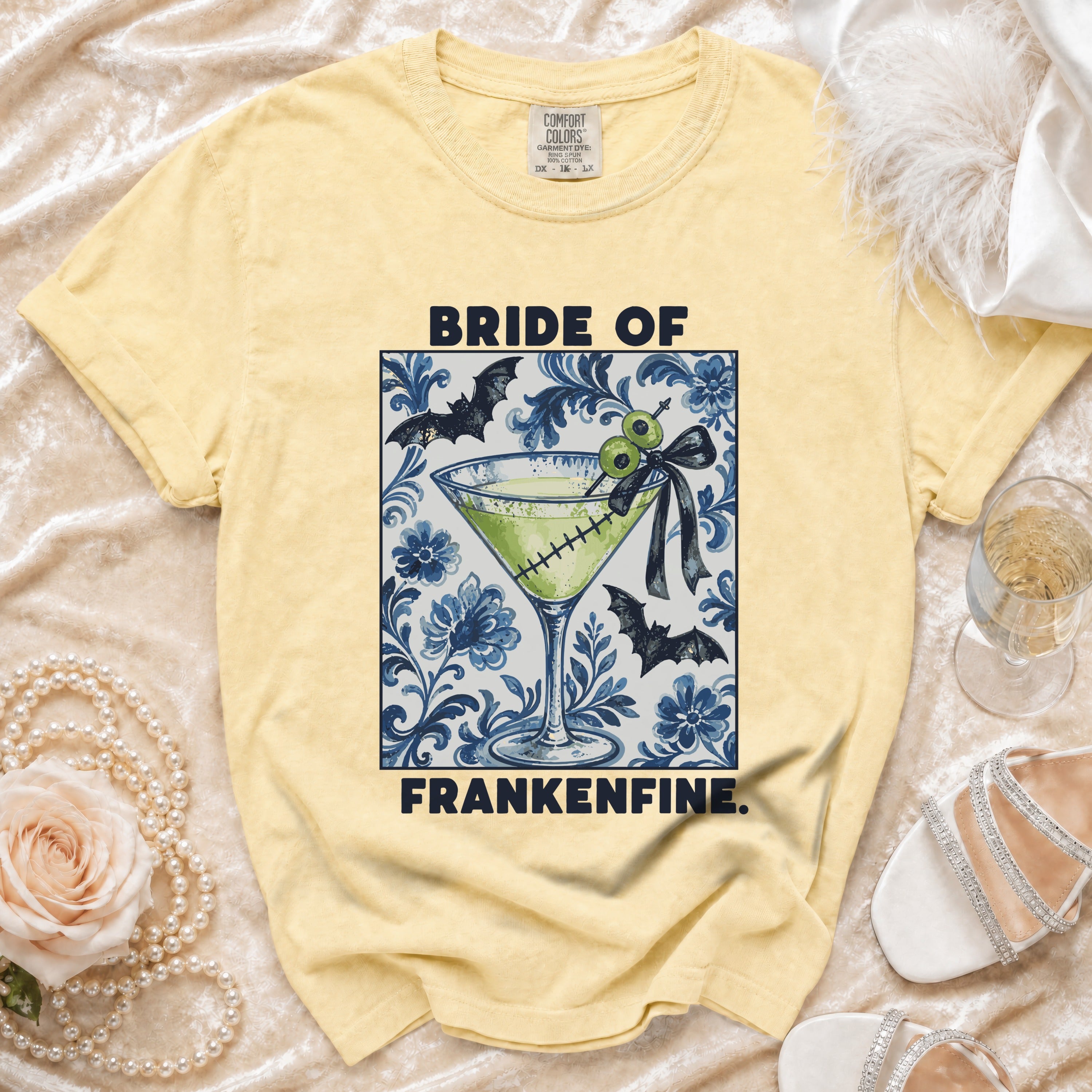 Yellow t-shirt with "BRIDE OF FRANKENFINE" text and Halloween cocktail graphic.