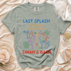 T-shirt with "Last Splash Sarah's Bach" text and colorful graphics.