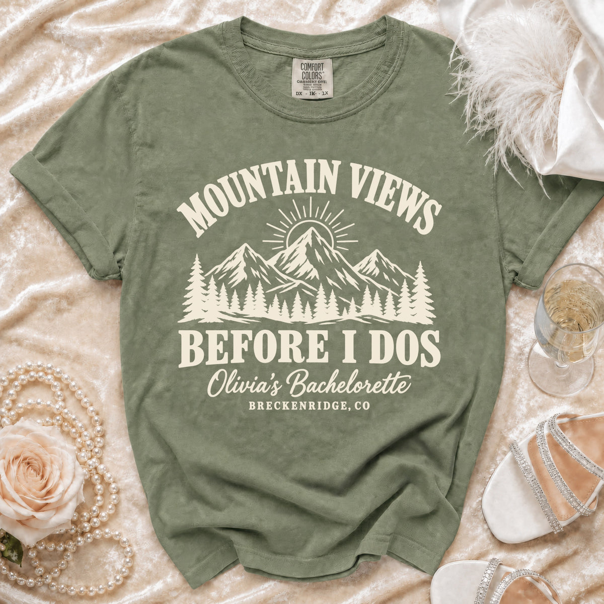 Olive green t-shirt with Mountain Views Before I Dos and Olivia's Bachelorette Breckenridge, CO printed on it.
