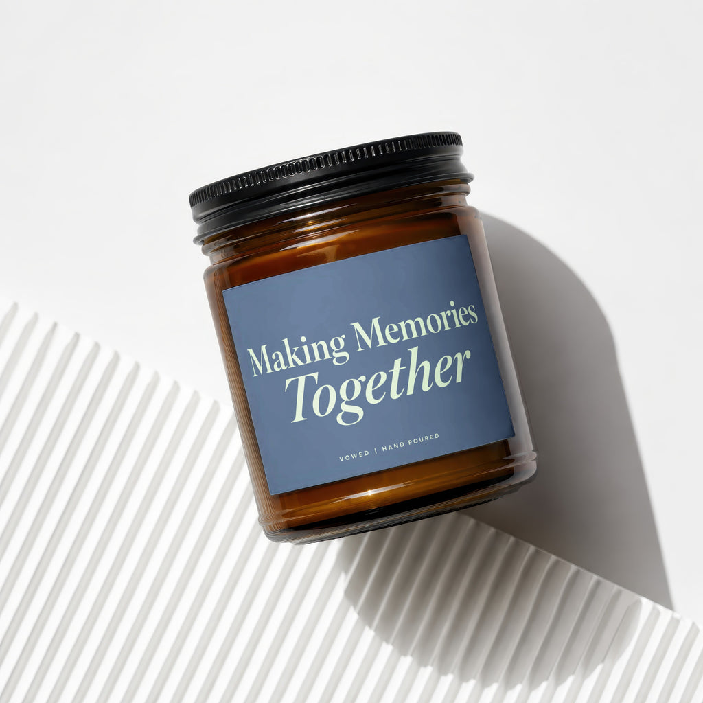 Amber glass candle with black lid, reads "Making Memories Together".