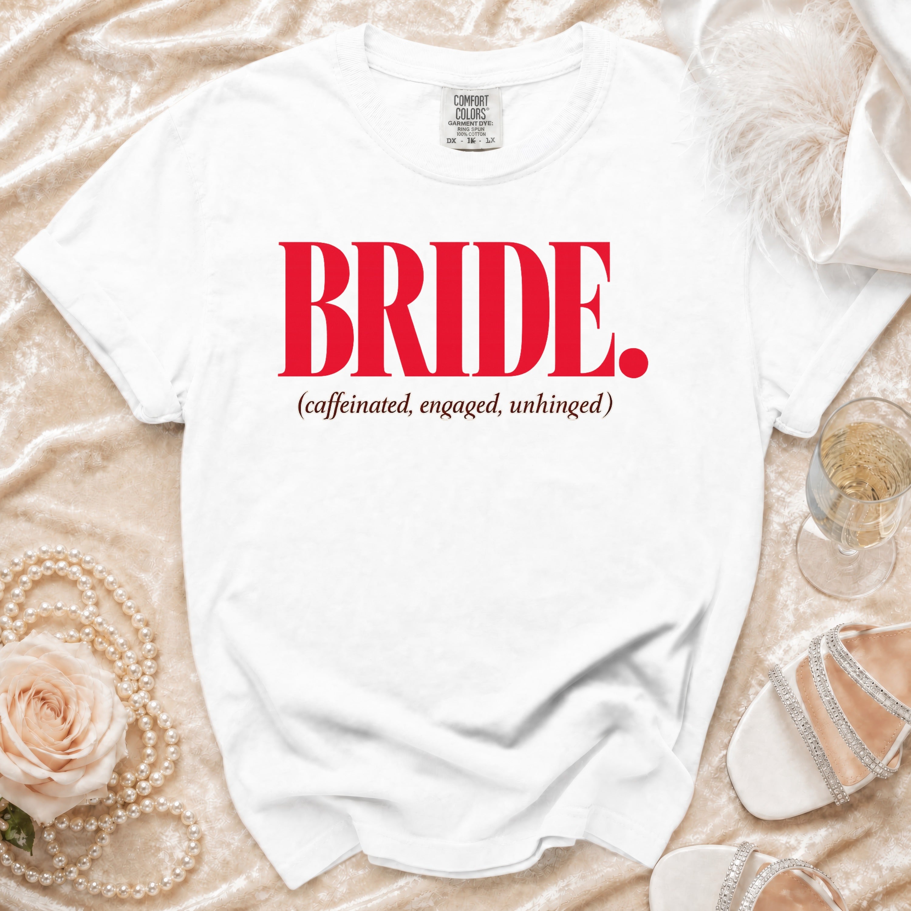 White t-shirt with red text "BRIDE. (caffeinated, engaged, unhinged)".