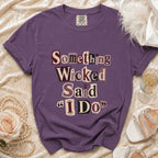 Purple t-shirt with "Something Wicked Said 'I Do'" text.