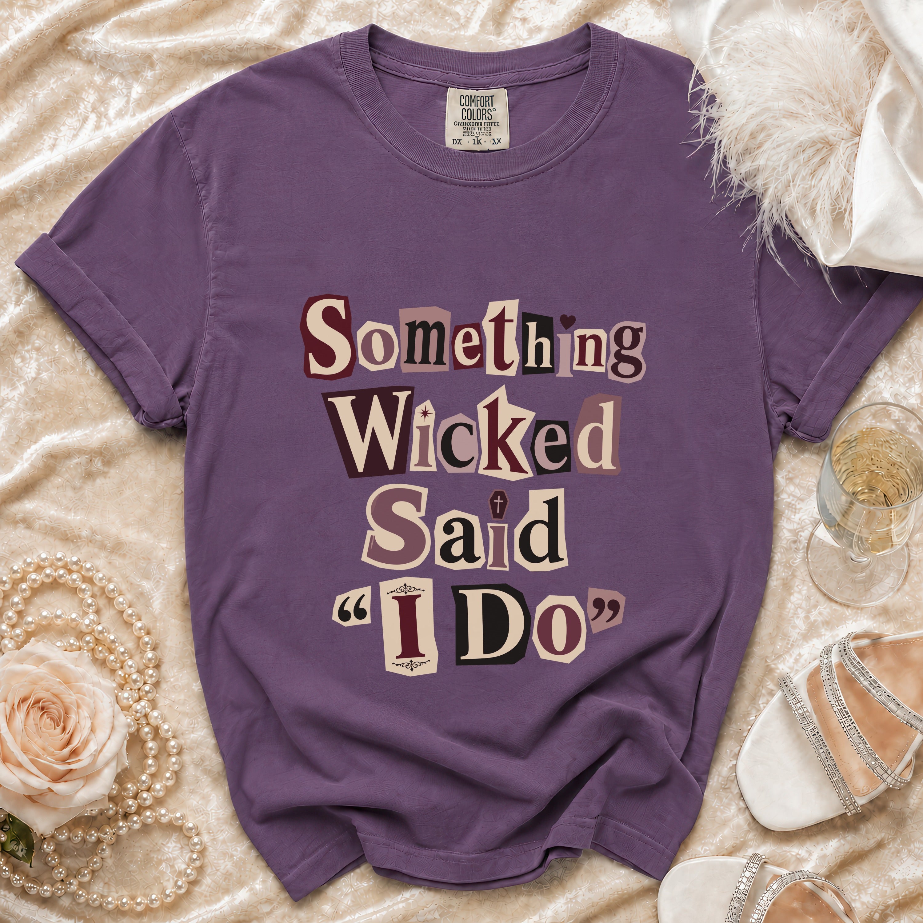 Purple t-shirt with "Something Wicked Said 'I Do'" text.
