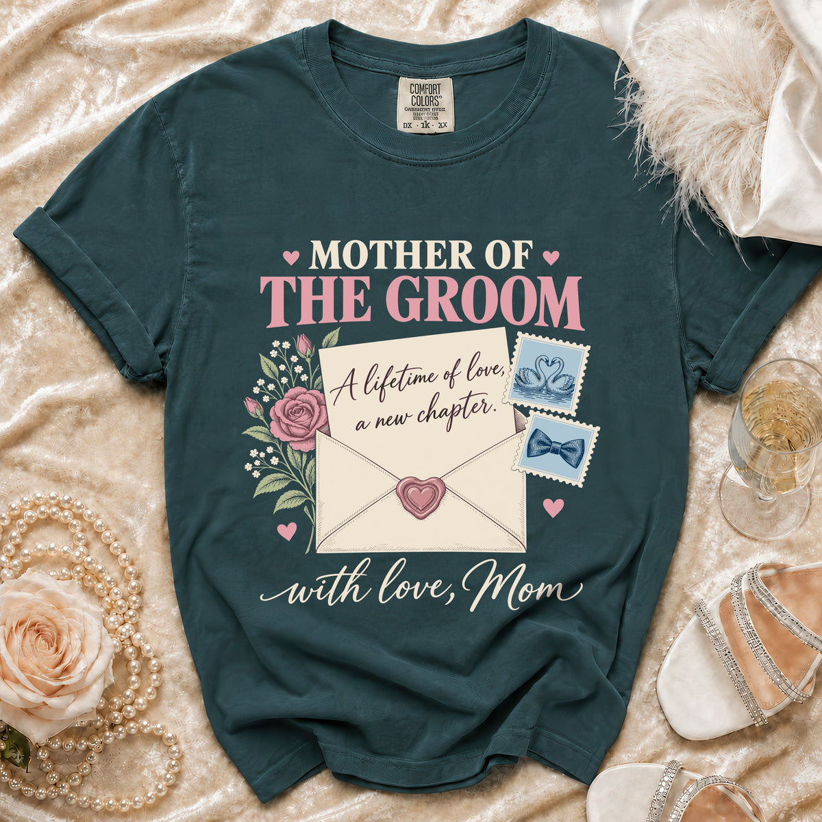Dark teal t-shirt with "Mother of the Groom" text, envelope graphic, and roses.