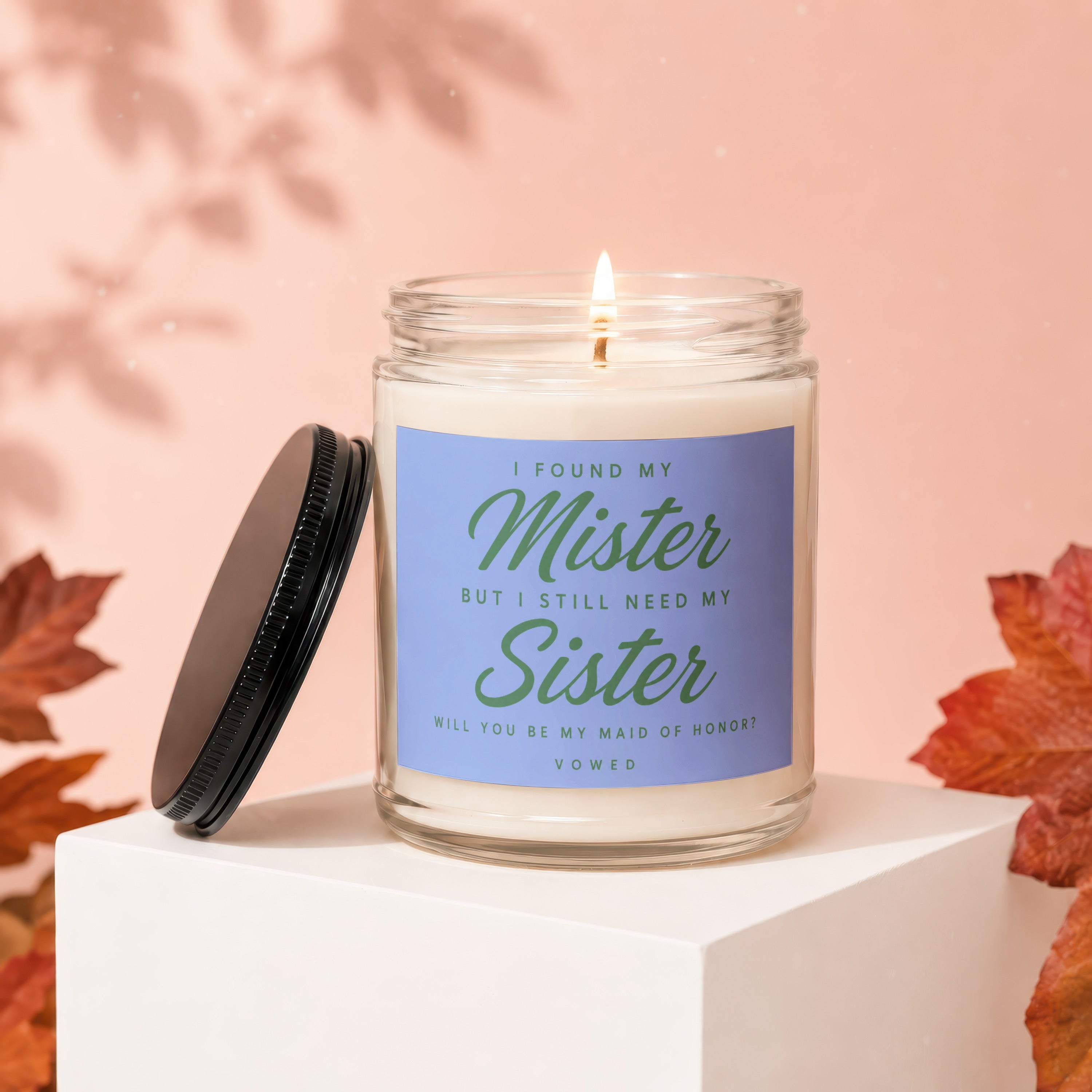 Candle with "I found my Mister but I still need my Sister" text.