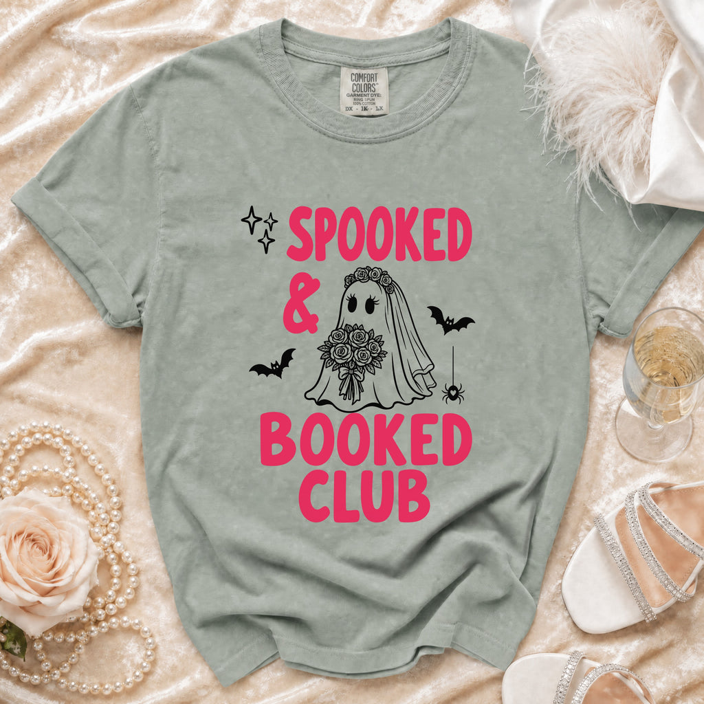 Sage green t-shirt with "Spooked & Booked Club" text and a bride ghost.