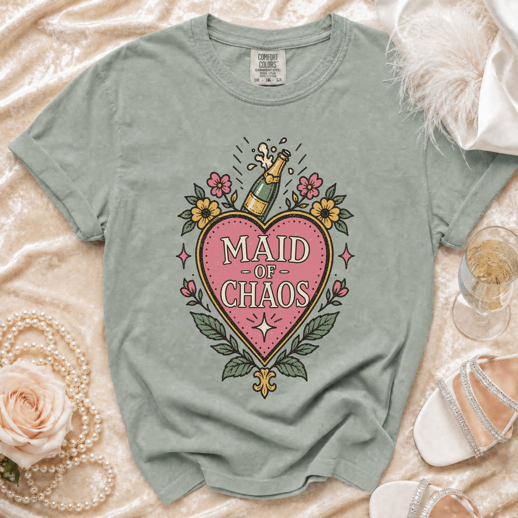 Light green t-shirt with pink heart graphic that says "MAID OF CHAOS".