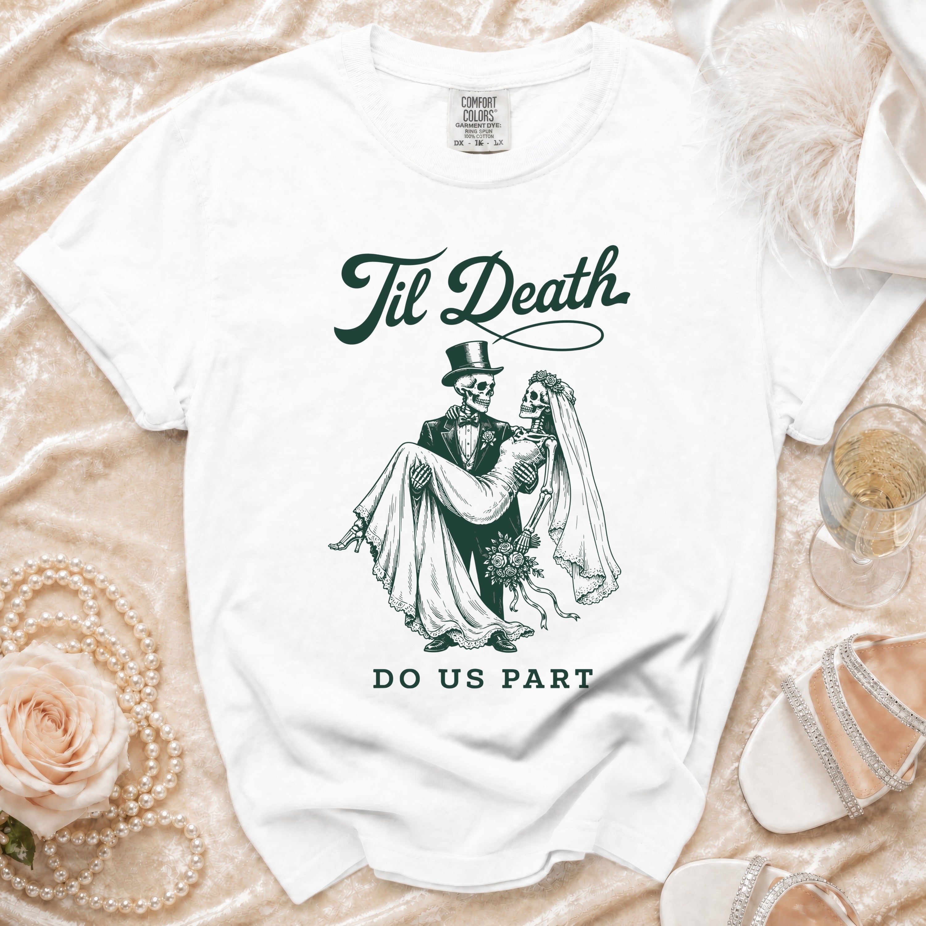 White t-shirt with dark green graphic of skeletons, "Til Death," and "DO US PART."