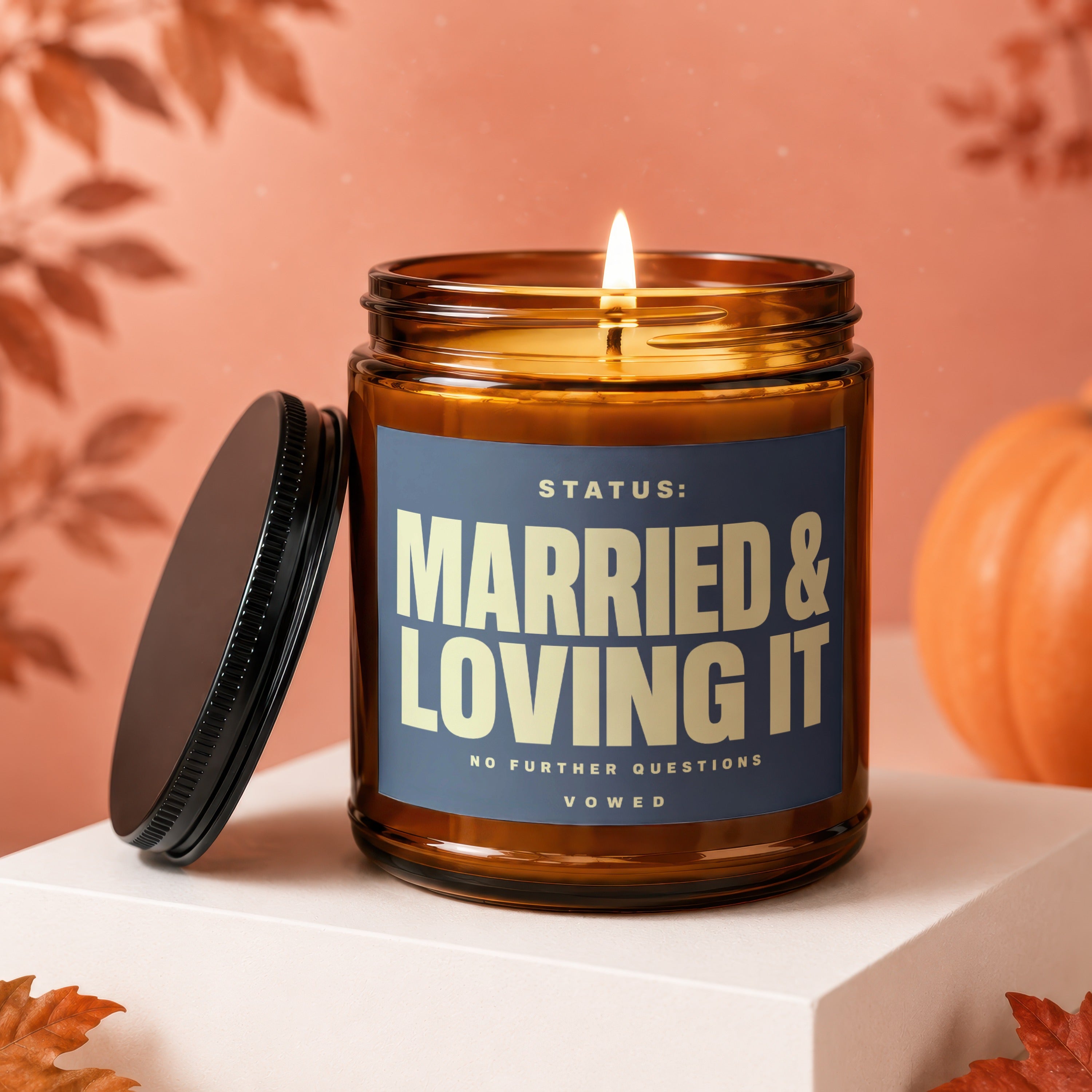 Amber jar candle lit with text "Married & Loving It" and "Vowed".
