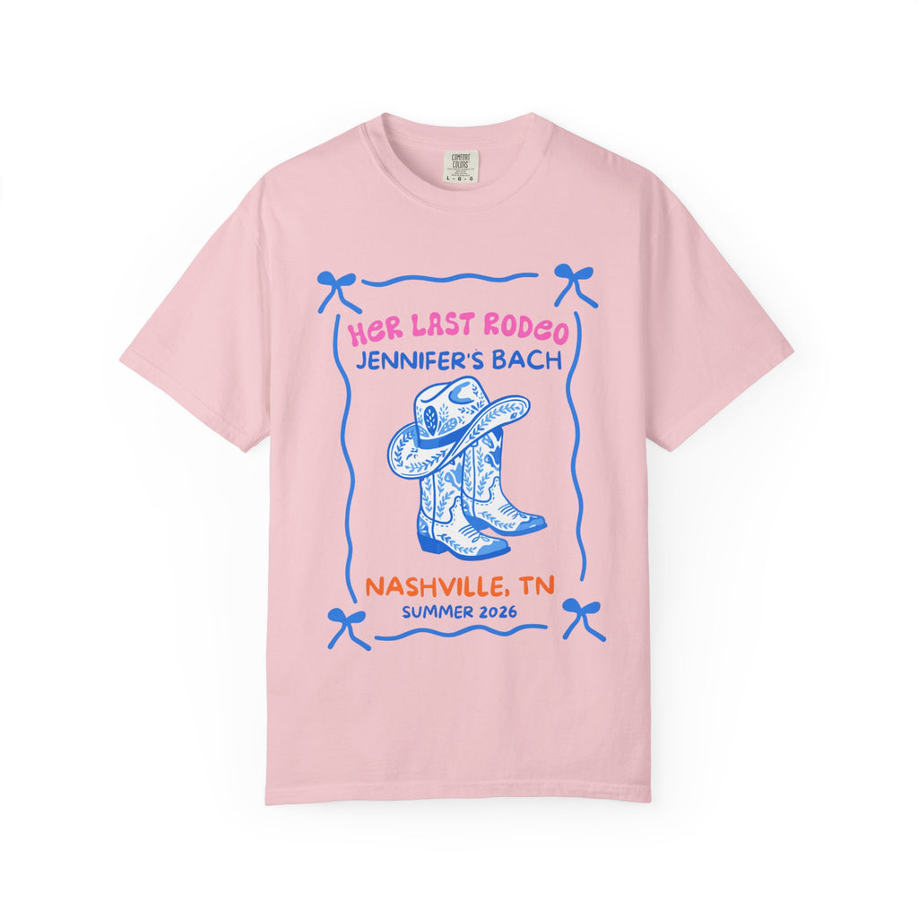 Pink t-shirt with "Her Last Rodeo Jennifer's Bach Nashville, TN Summer 2026" text and cowboy boots.