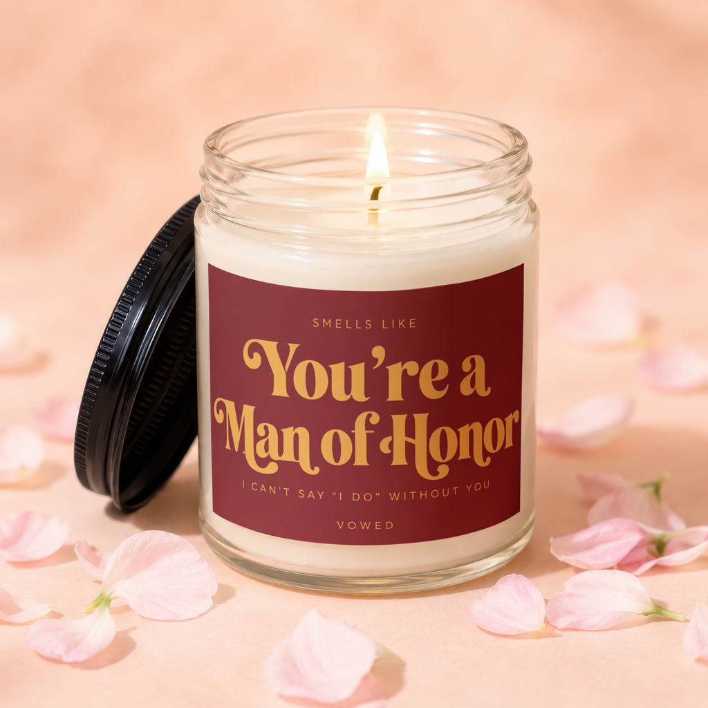 Lit candle with "You're a Man of Honor" text and petals.