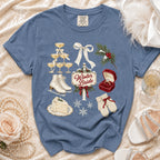Blue t-shirt with winter bride graphic including champagne, cake, skates, and snowflakes.
