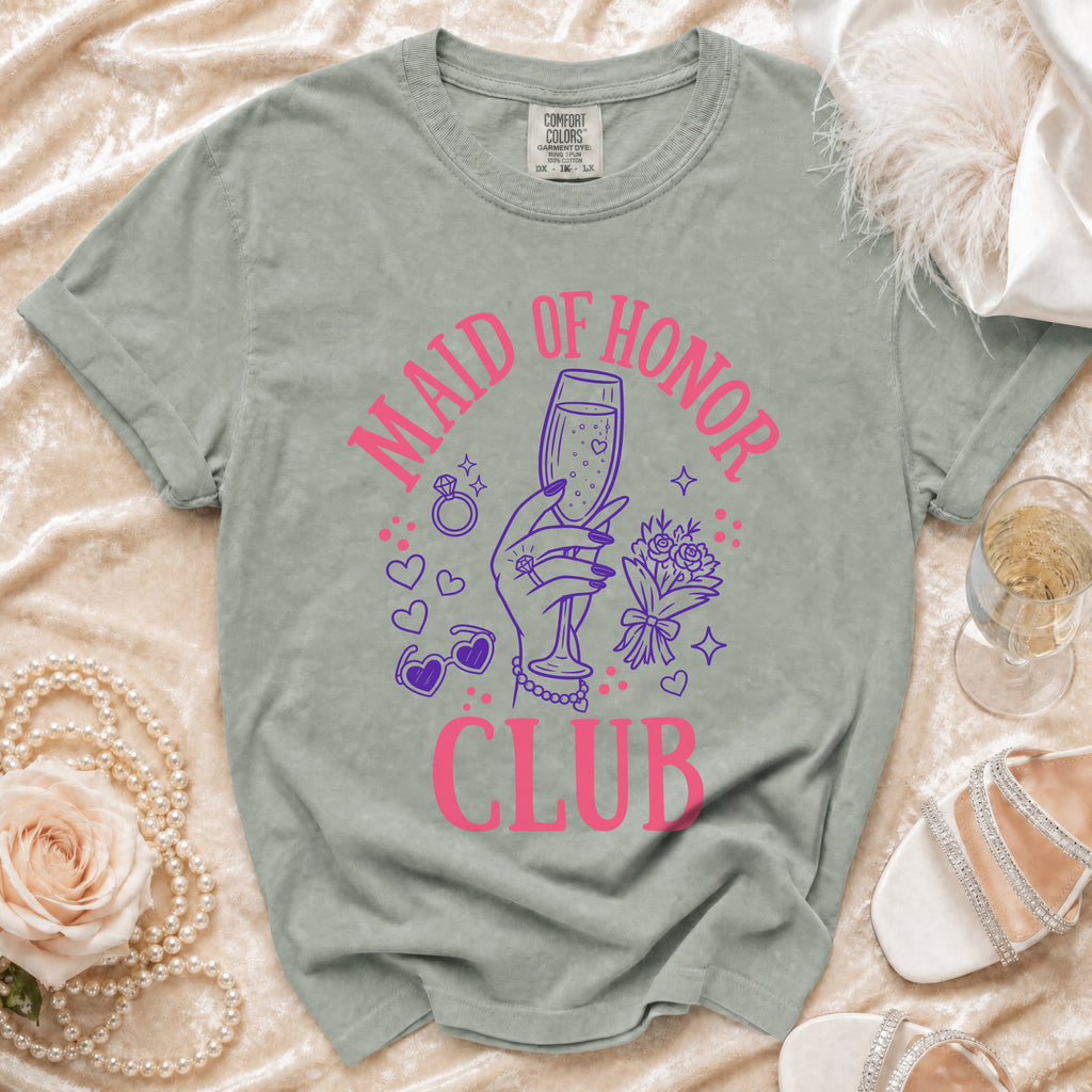 Green t-shirt with "MAID OF HONOR CLUB" text and wedding graphics.