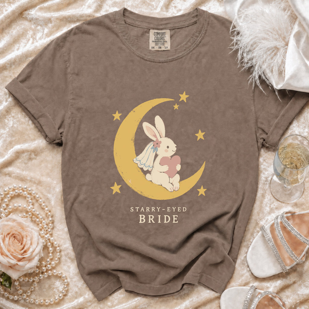 Brown t-shirt with a rabbit bride on a moon, text reads "STARRY-EYED BRIDE".