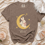 Brown t-shirt with a rabbit bride on a moon, text reads "STARRY-EYED BRIDE".