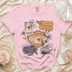 Pink t-shirt with "Bride of Boos" graphic featuring ghosts, postage stamps, and wedding-themed text.