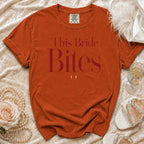 Orange t-shirt with "This Bride Bites" text and two small white fangs.