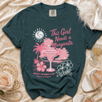 Dark teal t-shirt with "This Girl Needs a Margarita" and beach graphic.