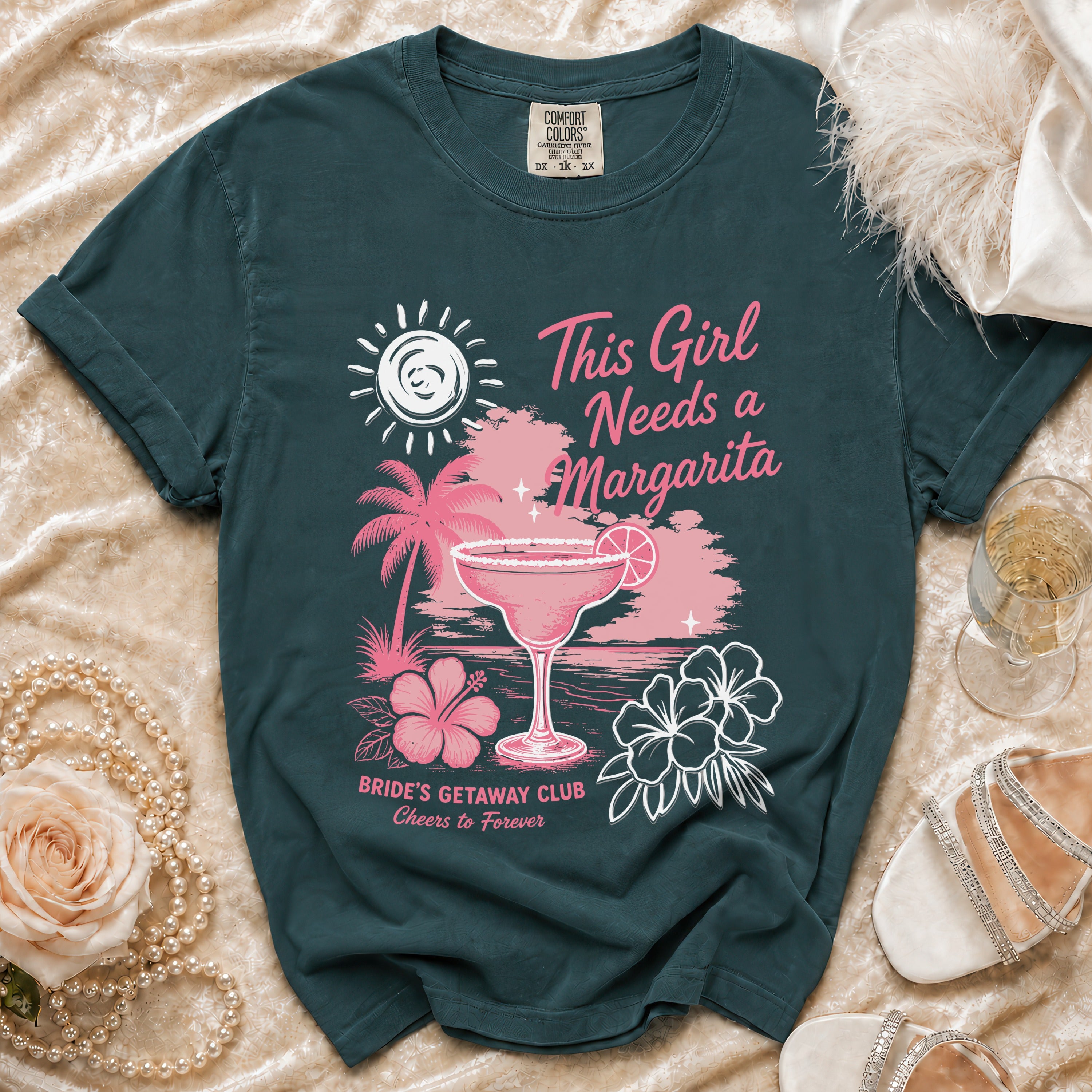 Dark teal t-shirt with "This Girl Needs a Margarita" and beach graphic.