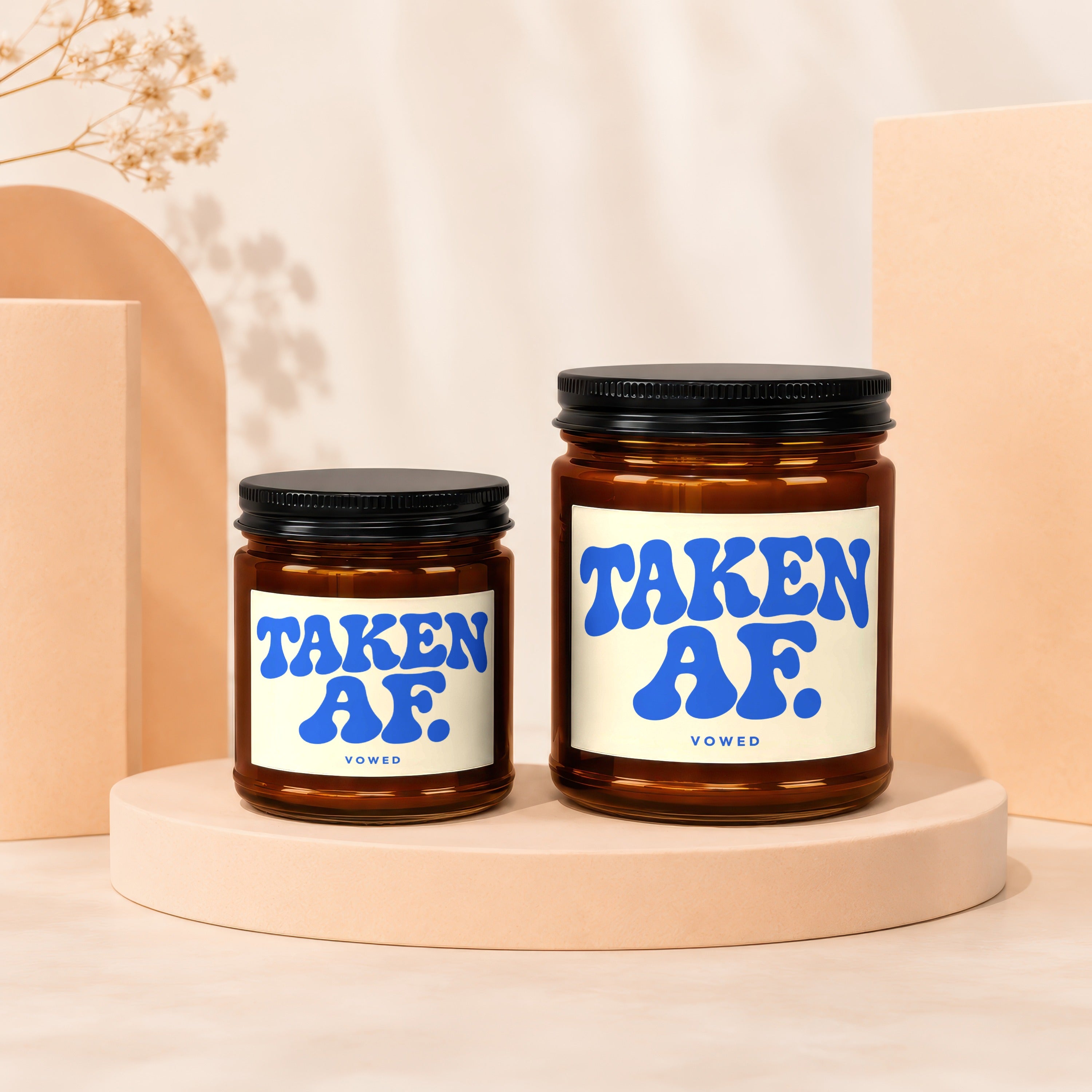 Two amber jars with black lids, labels read "TAKEN AF. VOWED".