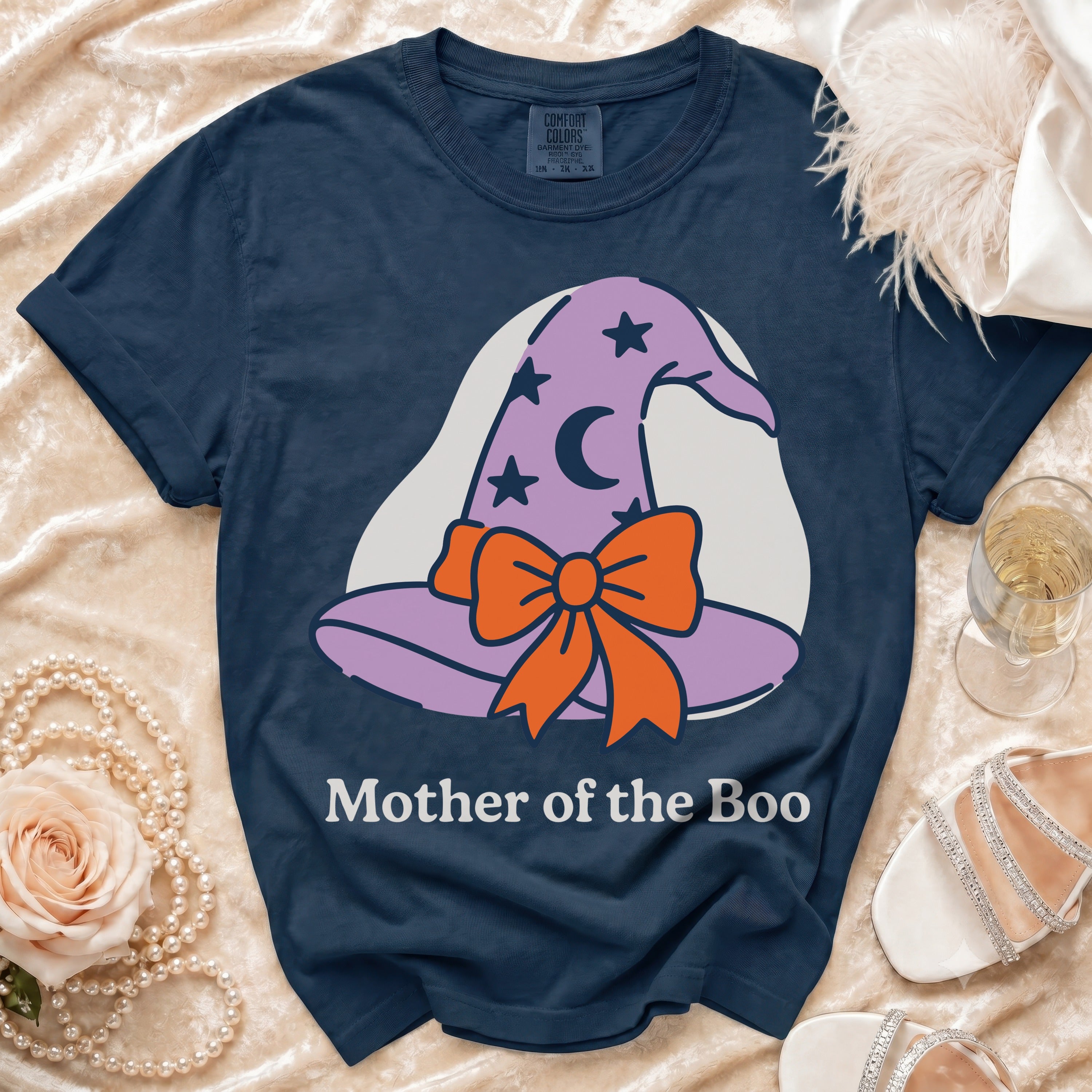 Navy t-shirt with a graphic of a purple witch hat and the text "Mother of the Boo".